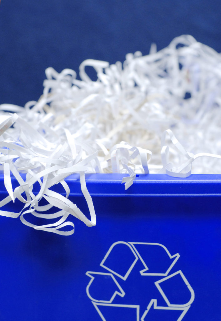 Blue Recycle Bin with Shredded Paper - Challenger Learning Center of Maine